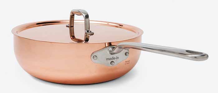 Image of a copper saucier with stainless steel handle.