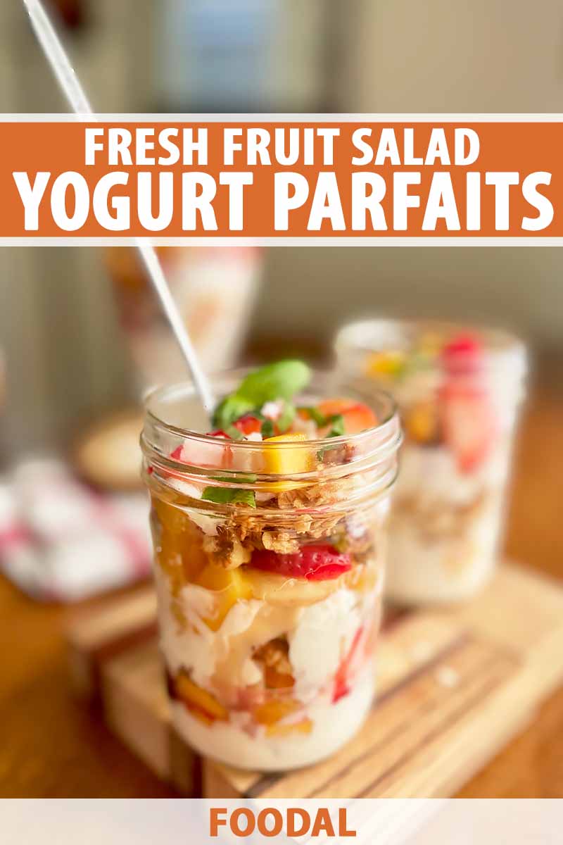 Vertical image of a glass mason jar filled with bananas, strawberries, granola, and yogurt with herb topping, with text on the top and bottom of the image.
