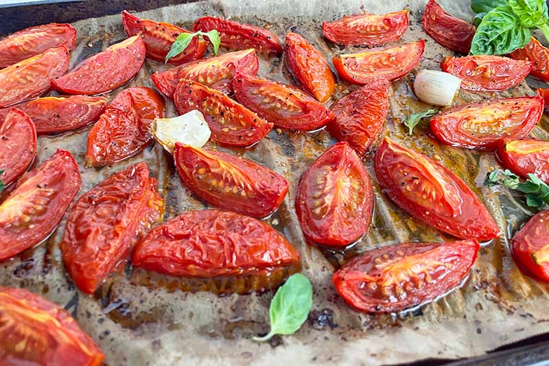 Horizontal image of roasted vegetables on a sheet pan.