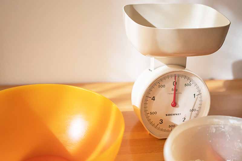 Horizontal image of a scale and bowls.