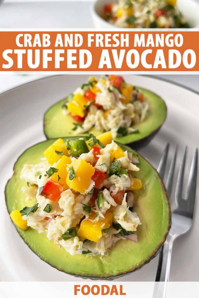 Vertical image of avocado halves filled with a salad on a white plate, with text on the top and bottom of the image.