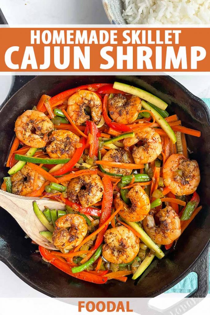 Vertical image of a cast iron filled with seafood and assorted veggies, with text on the top and bottom of the image.