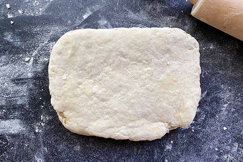 Horizontal image of a flattened rectangle of dough.