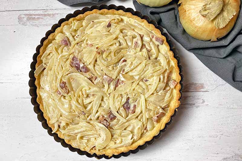 Horizontal image of an unbaked savory pie.