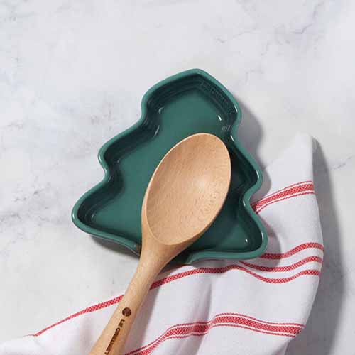 Image of a Christmas tree spoon rest from Le Creuset.