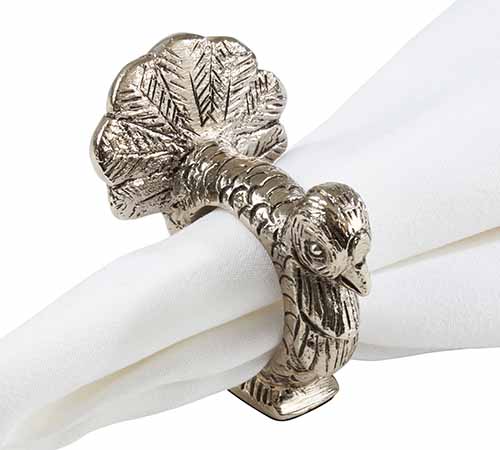 Image of a silver turkey napkin ring holding a white napkin.