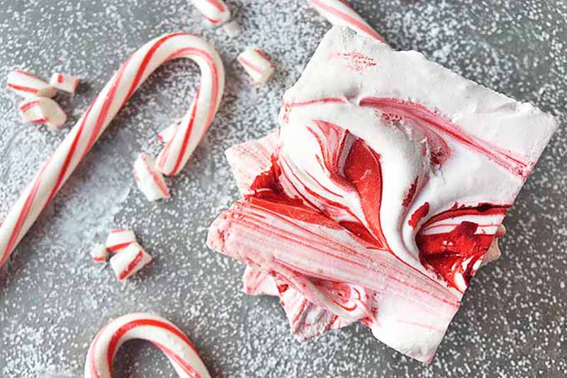 Horizontal image of squares of peppermint swirl marshmallows.