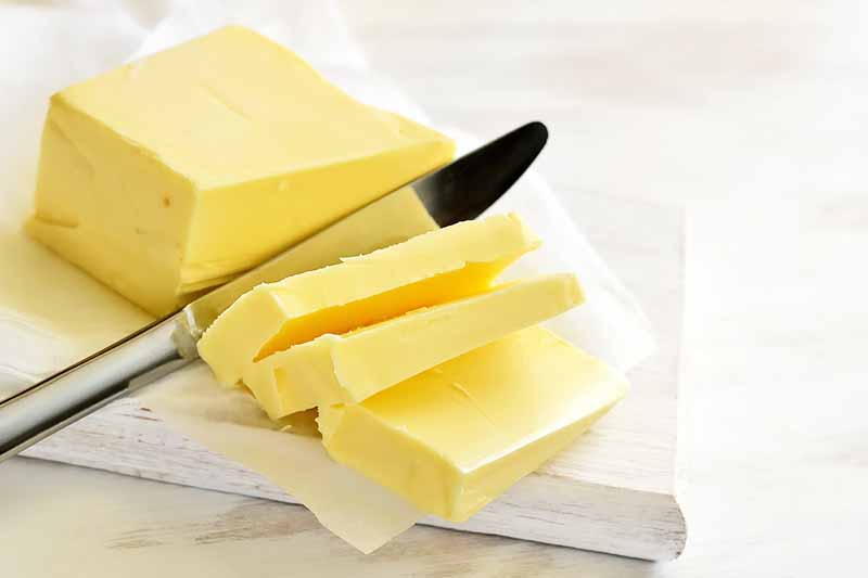 Horizontal image of sliced butter.