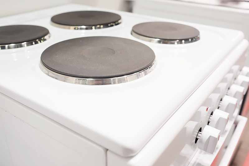 Horizontal image of an electric stove with solid discs.