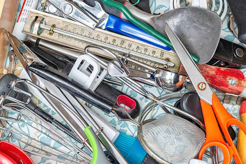 Horizontal image of a pile of tools.