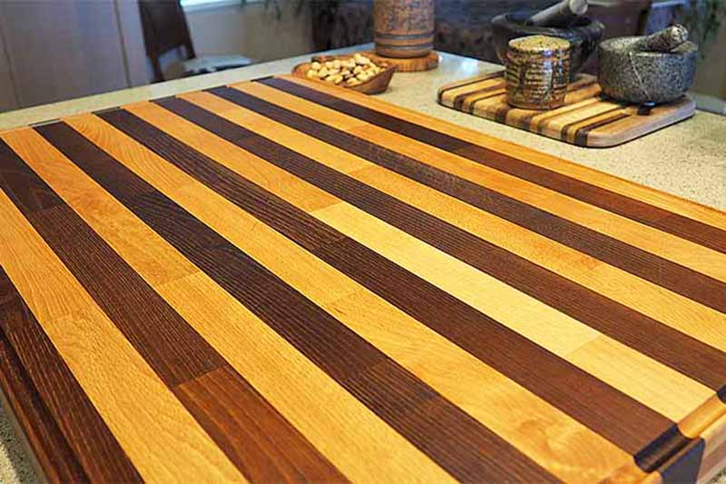 Horizontal image of a beautifully clean butcher block on a kitchen counter.