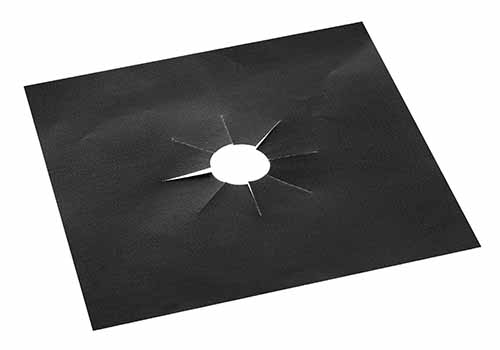 Image of a stove cooktop burner black cover.