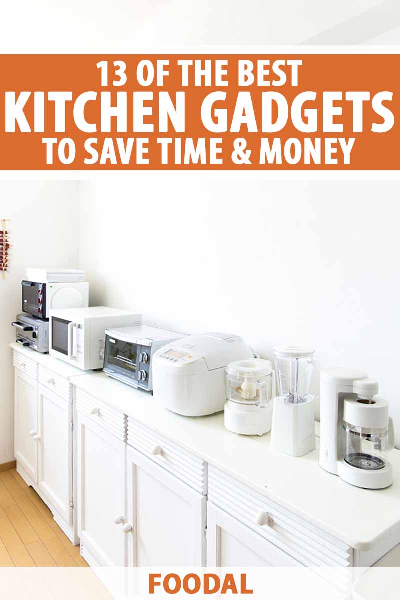 Vertical image of a kitchen countertop full of various appliances.