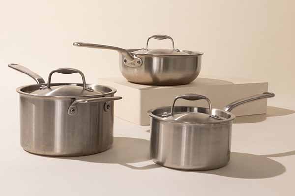 Image of Made In's 6-piece stainless steel kitchen equipment set with lids.