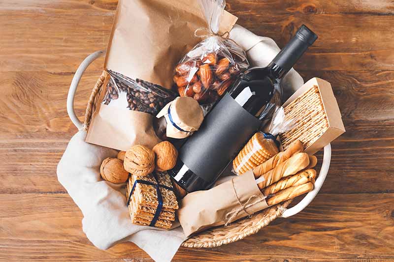 Horizontal image of a gift basket with food items.