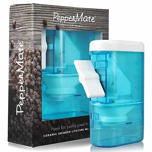 Image of the PepperMate Traditional in a transparent aqua color next to its box.